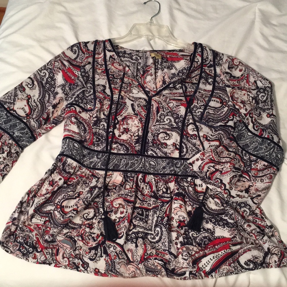 very flowery and soft colorful v-neck blouse.